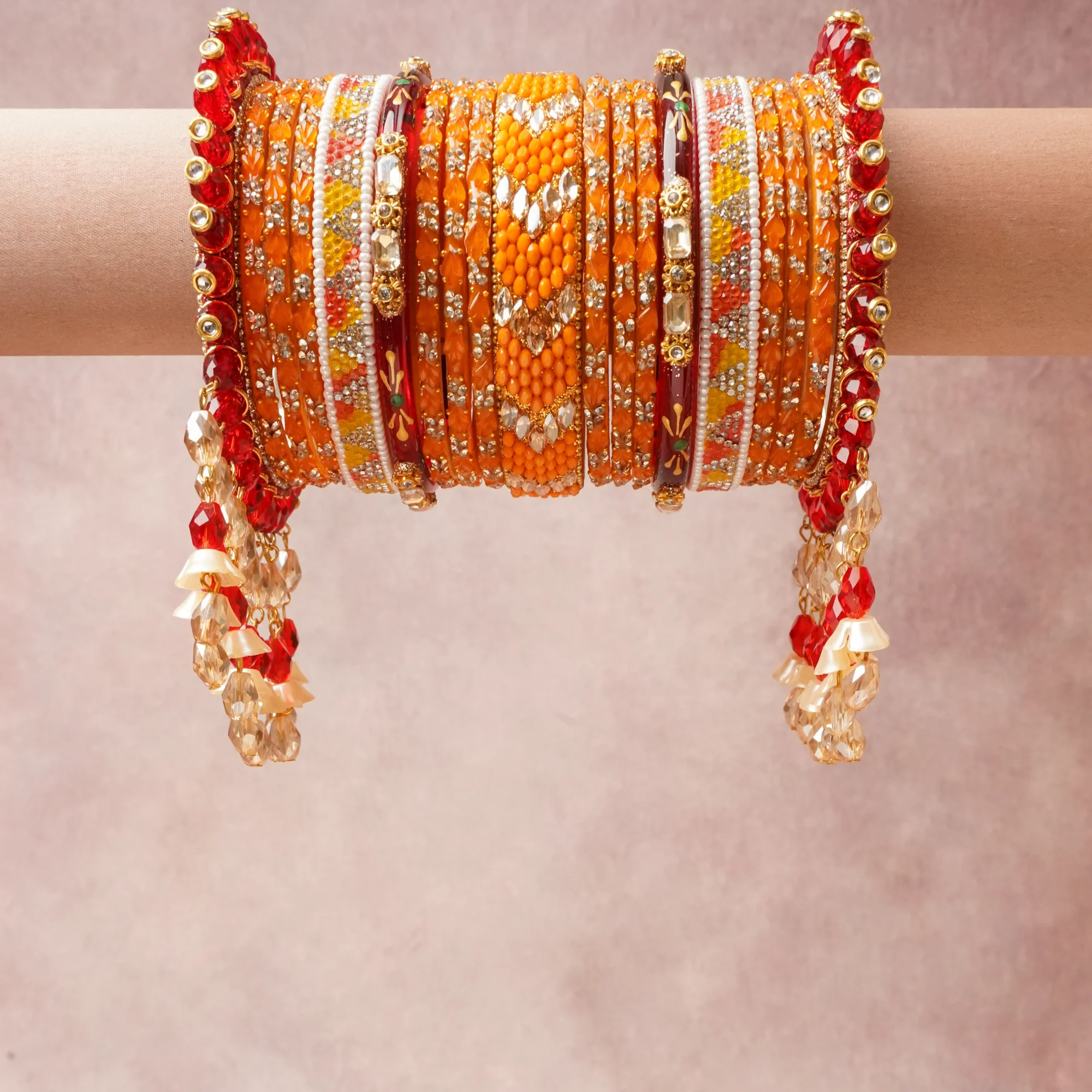 A commanding Orange anchors this beautiful set, enriched with accents of Crimson Red, Gold, Clear Crystal, White, Marigold Yellow, Burgundy, Emerald Green that add depth and dimension.

Featuring a striking composition of Glass, Metal (Gold-toned), Rhinestones, Faux Pearls, Crystal Beads, Resin Beads, Enamel, this set carries intricate craftsmanship and strong presence. Grand in form, it is created for moments that deserve to be marked.